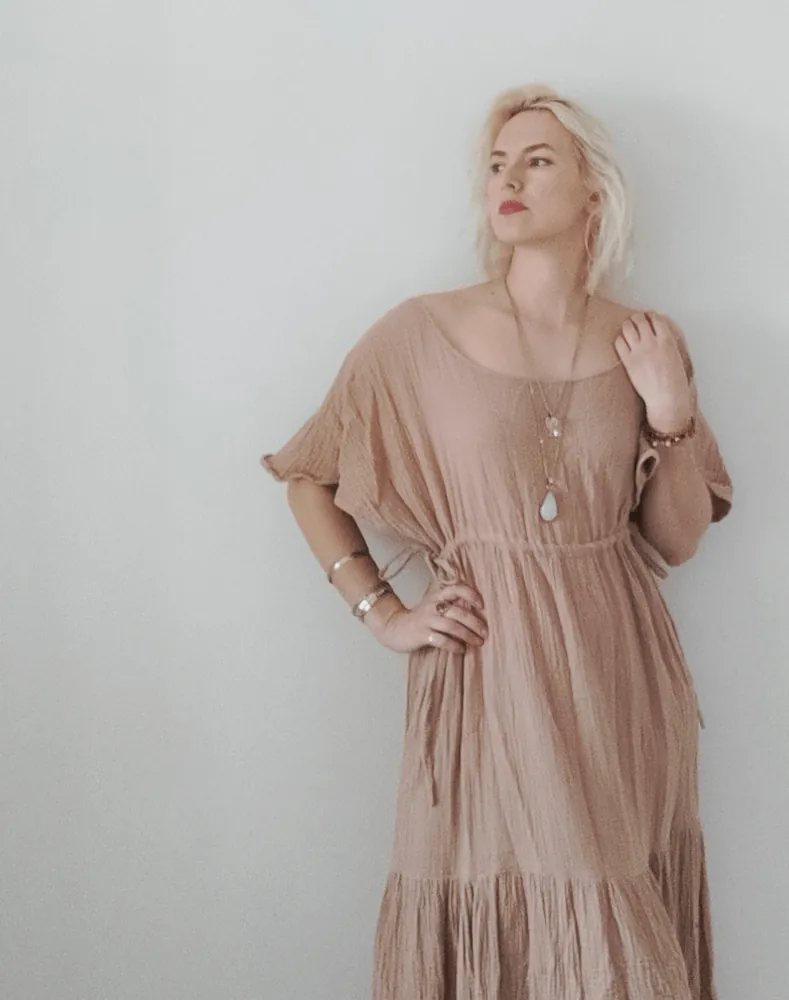 Goddess muslin maxi dress on a model, front view with a wide neckline and short sleeves